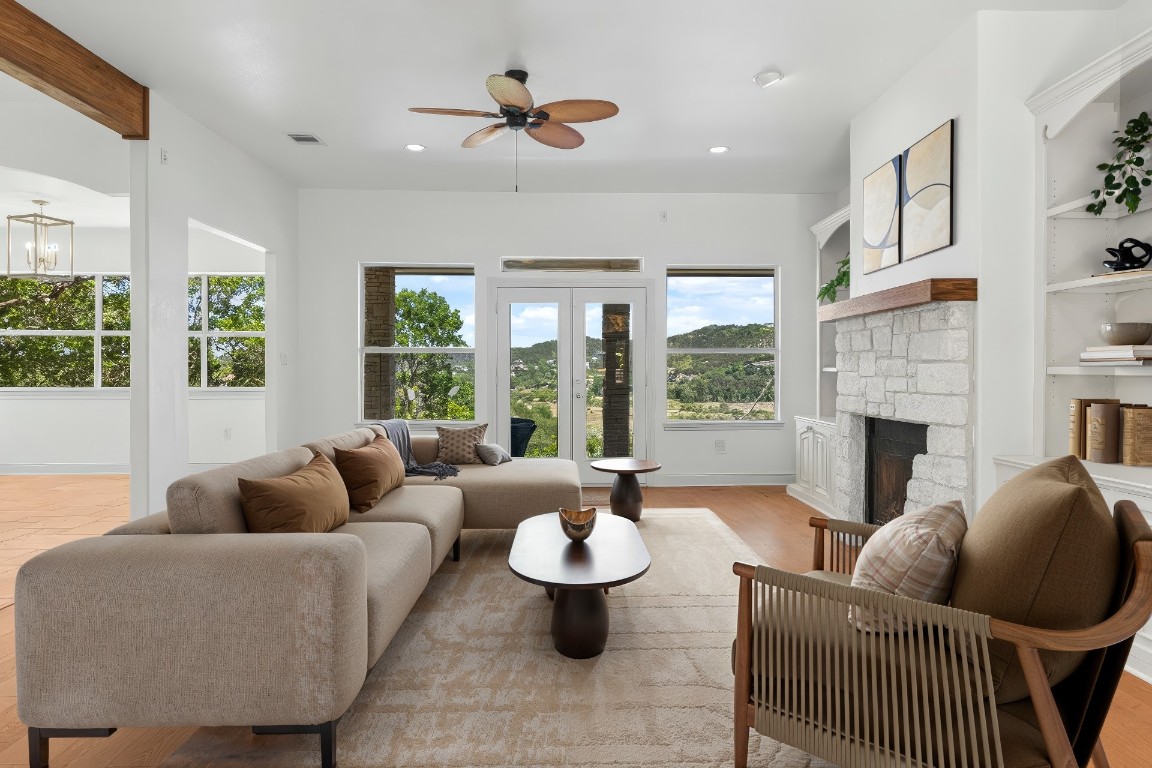18408 West Rim Drive Jonestown, TX 78645 - Photo 7 of 30 a living room with furniture and a large window