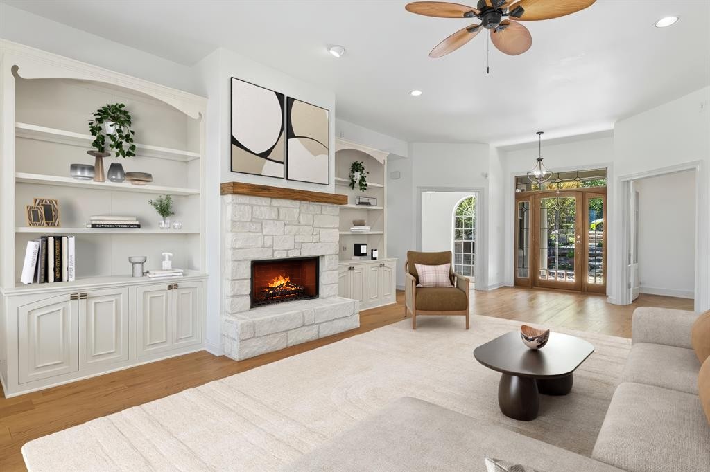 18408 West Rim Drive Jonestown, TX 78645 - Photo 9 of 30 a living room with furniture and a fireplace