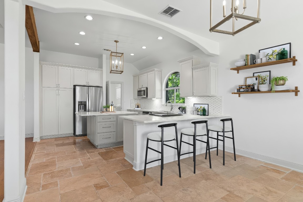 18408 West Rim Drive Jonestown, TX 78645 - Photo 10 of 30 a kitchen with sink cabinets and window