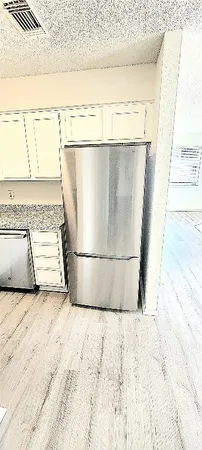 a view of a refrigerator in the room