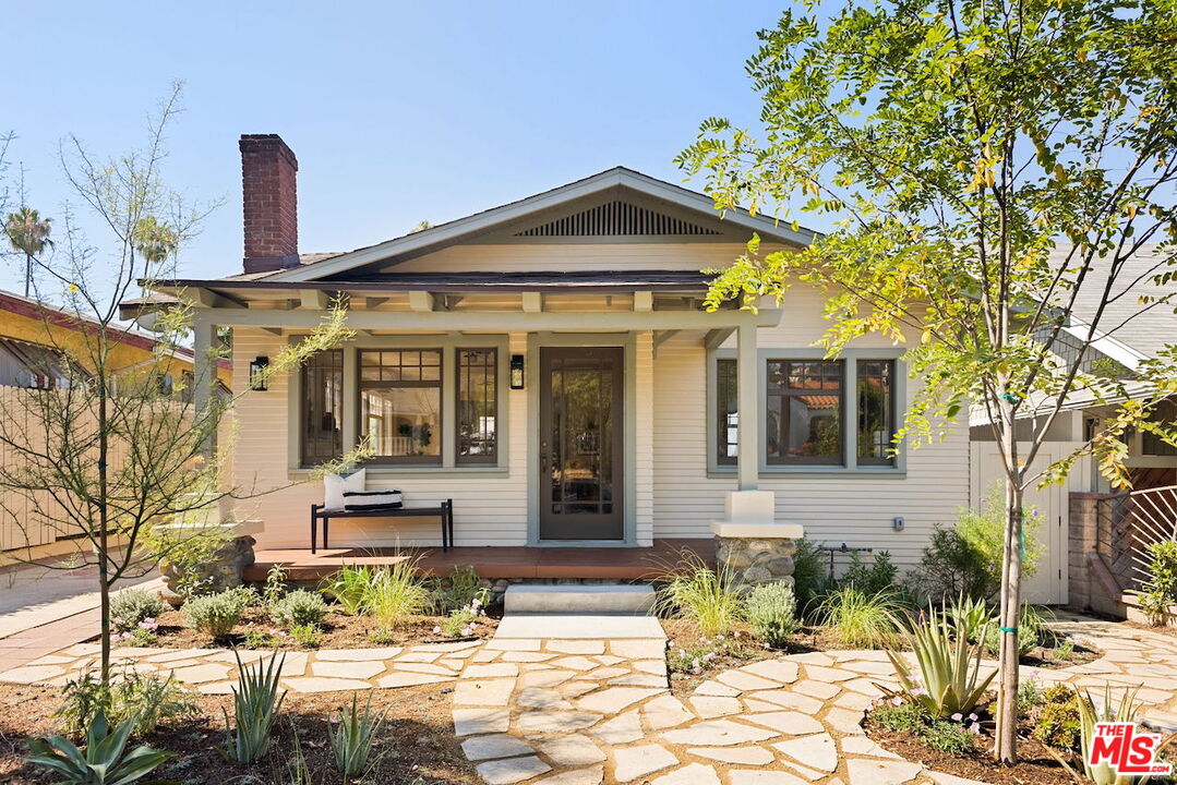 4908 Stratford Road Los Angeles, CA 90042 - Photo 1 of 1 a front view of a house with a yard