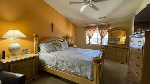 a bedroom with a bed and window