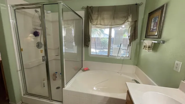 a bathroom with a bathtub and a shower