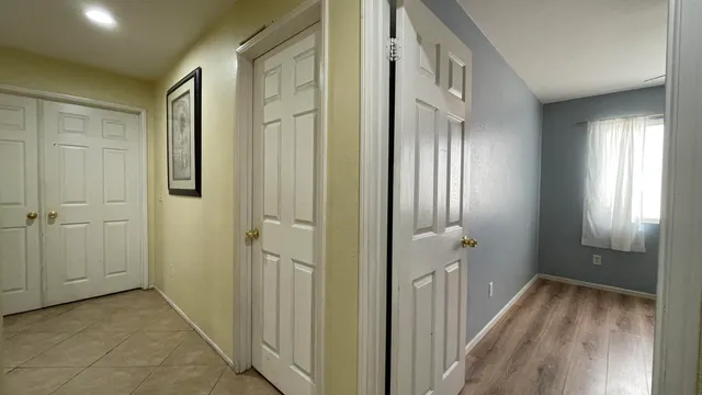 a view of a hallway with front door