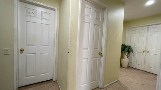 a view of a hallway with some storage area