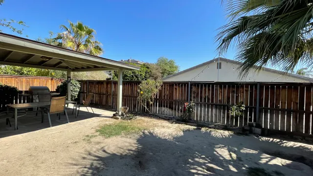 a view of outdoor space with swimming pool and furniture