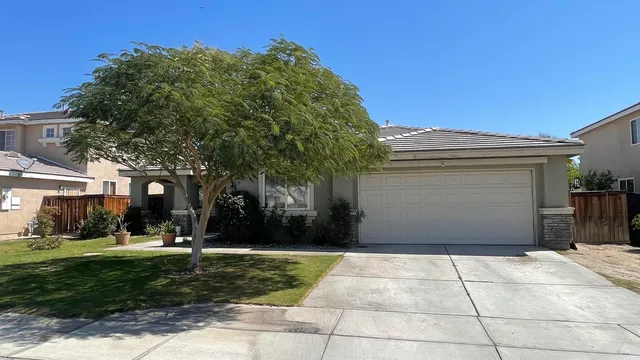 a front view of a building with garden