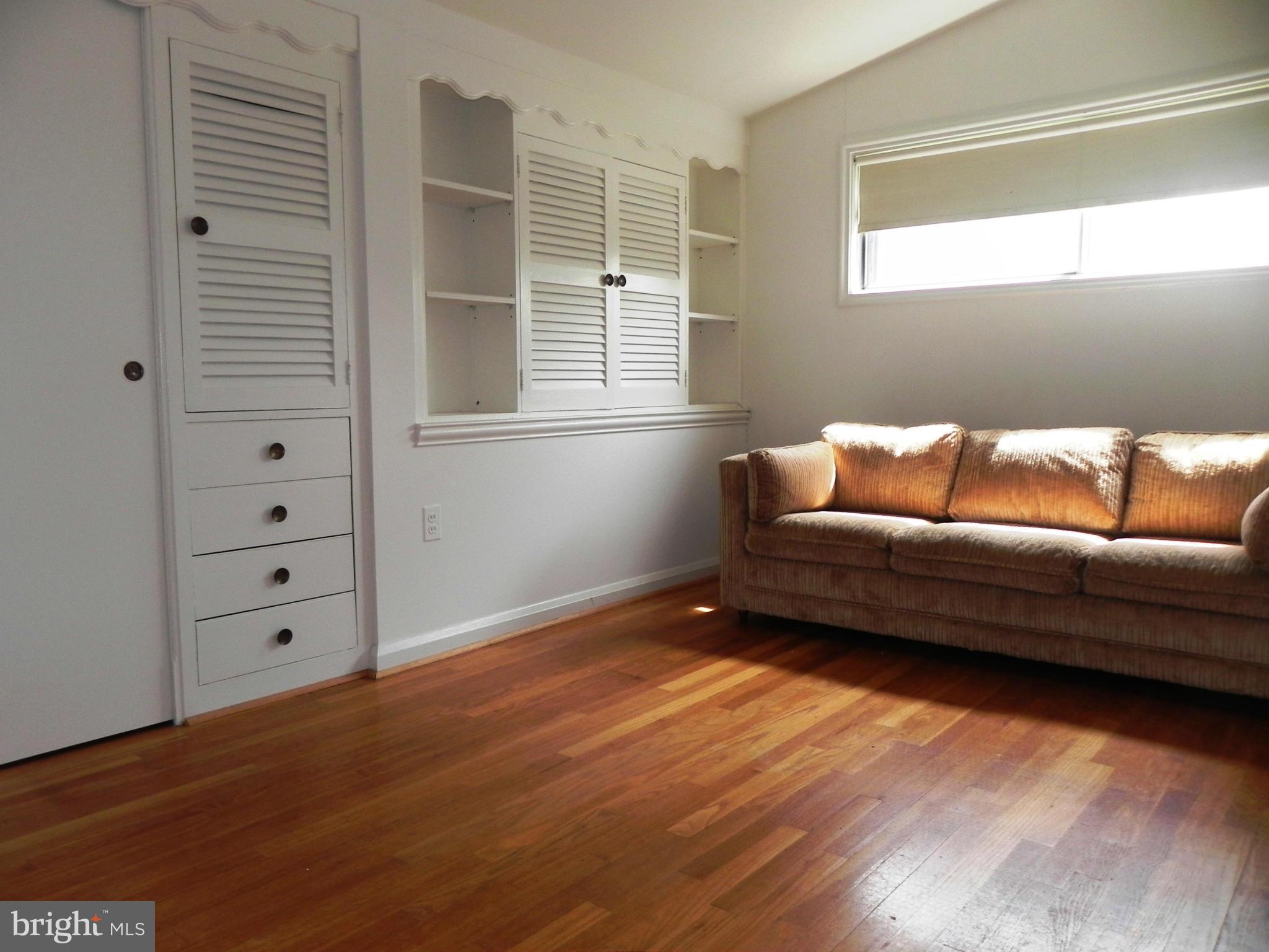 7420 Monita Road Baltimore, MD 21208 - Photo 12 of 24 a living room with furniture and a window