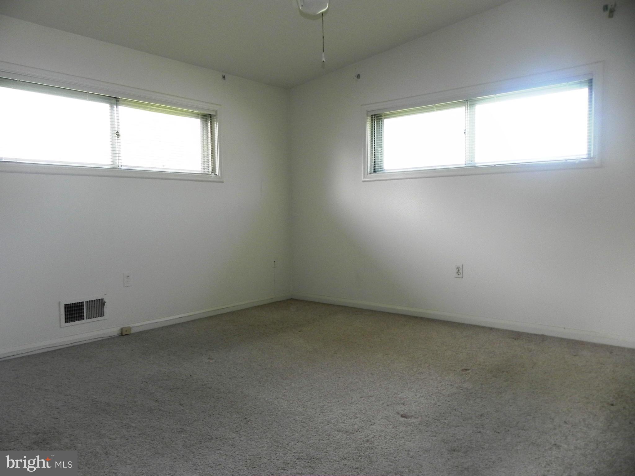 7420 Monita Road Baltimore, MD 21208 - Photo 15 of 24 an empty room with a window