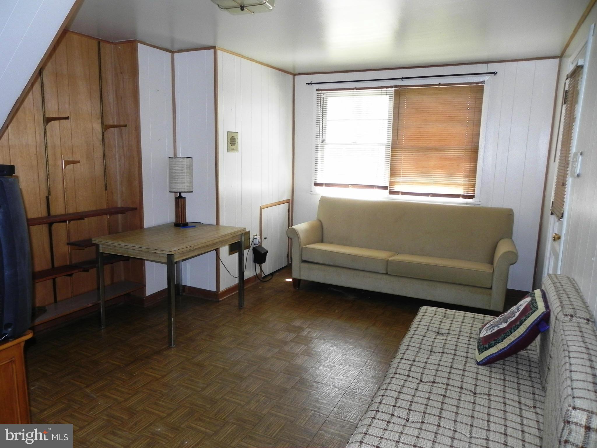 7420 Monita Road Baltimore, MD 21208 - Photo 20 of 24 a living room with furniture and a window