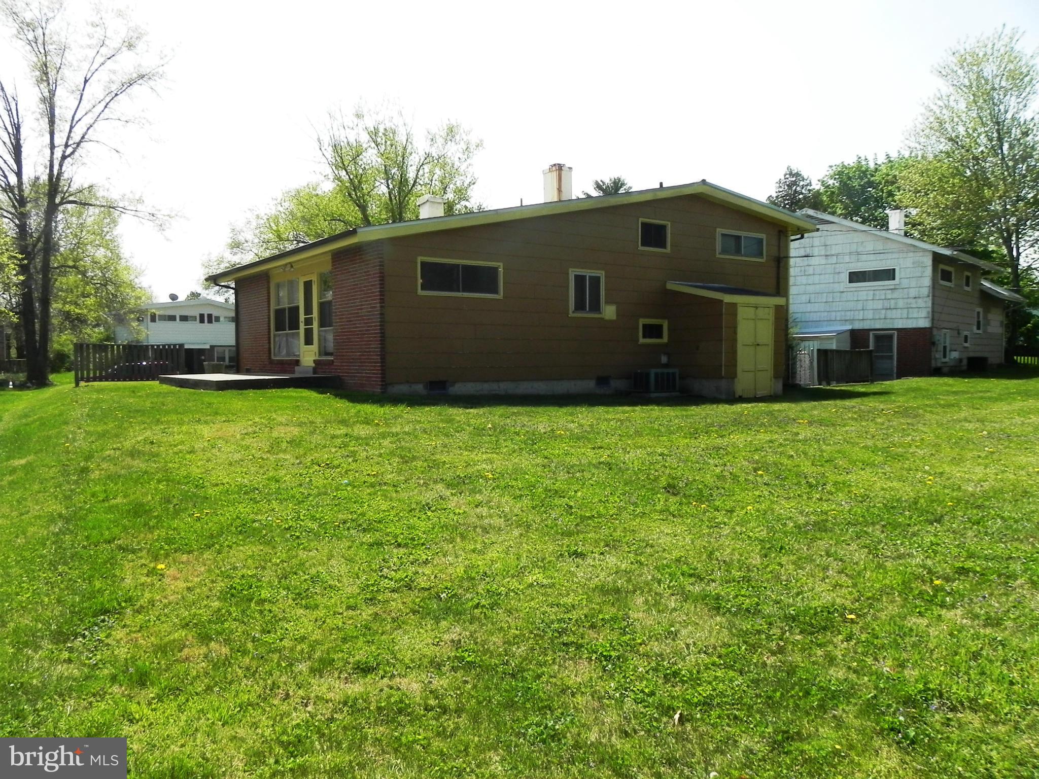 7420 Monita Road Baltimore, MD 21208 - Photo 21 of 24 a front view of house with yard and trees