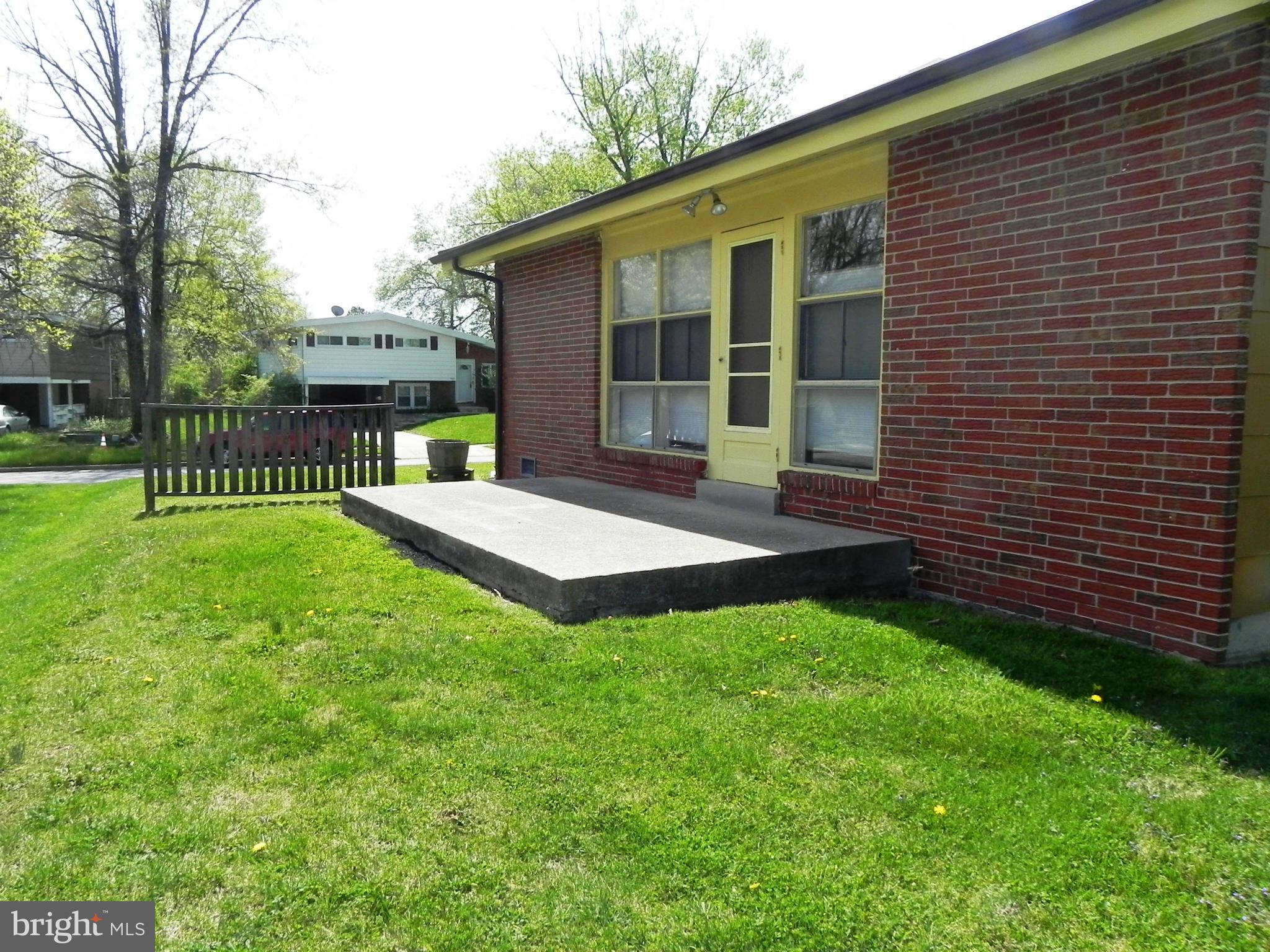 7420 Monita Road Baltimore, MD 21208 - Photo 22 of 24 a view of a house with a yard and sitting area