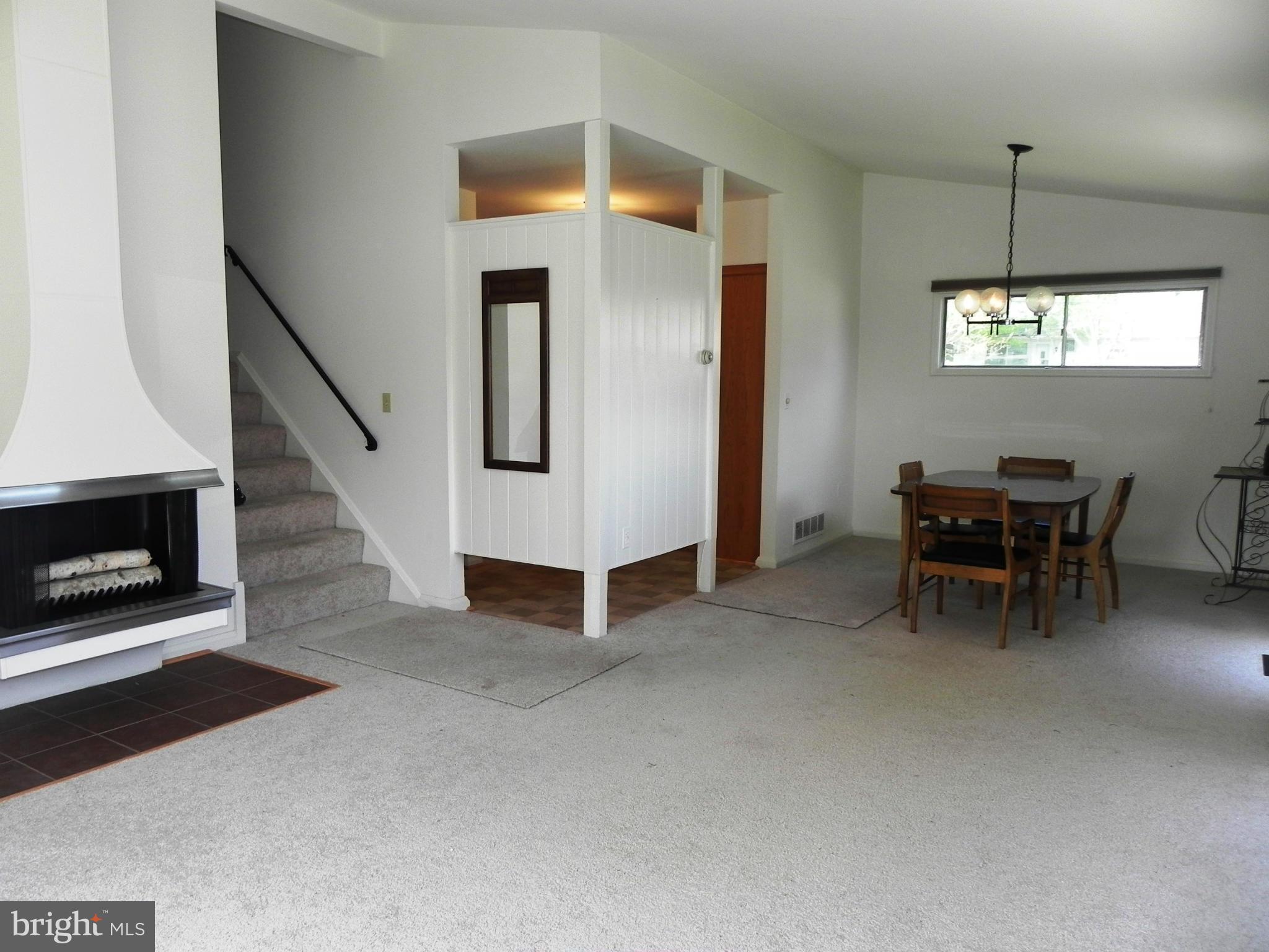 7420 Monita Road Baltimore, MD 21208 - Photo 5 of 24 a view of a livingroom with furniture and chandelier kitchen