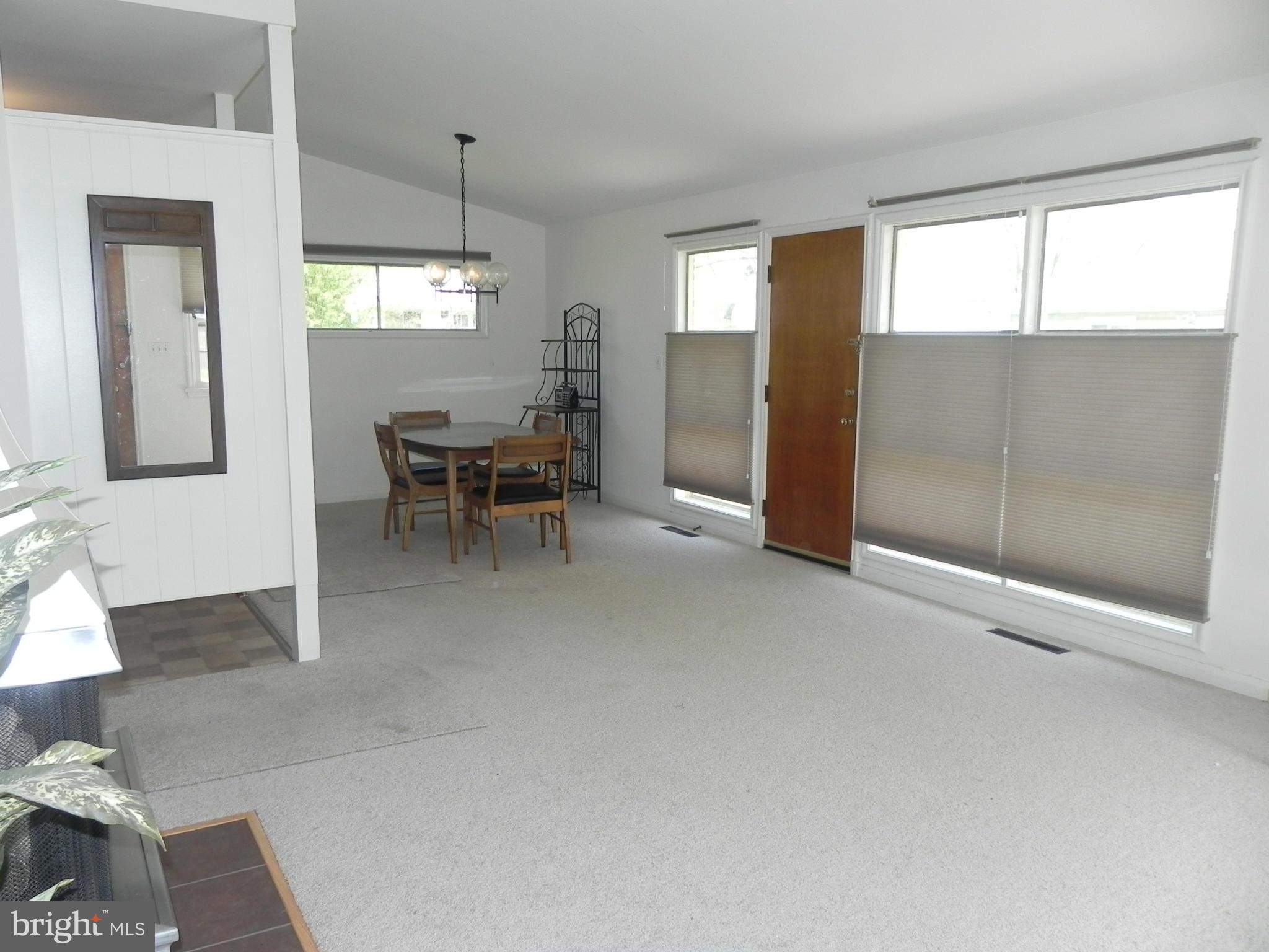 7420 Monita Road Baltimore, MD 21208 - Photo 6 of 24 a view of a livingroom with furniture window and wooden floor