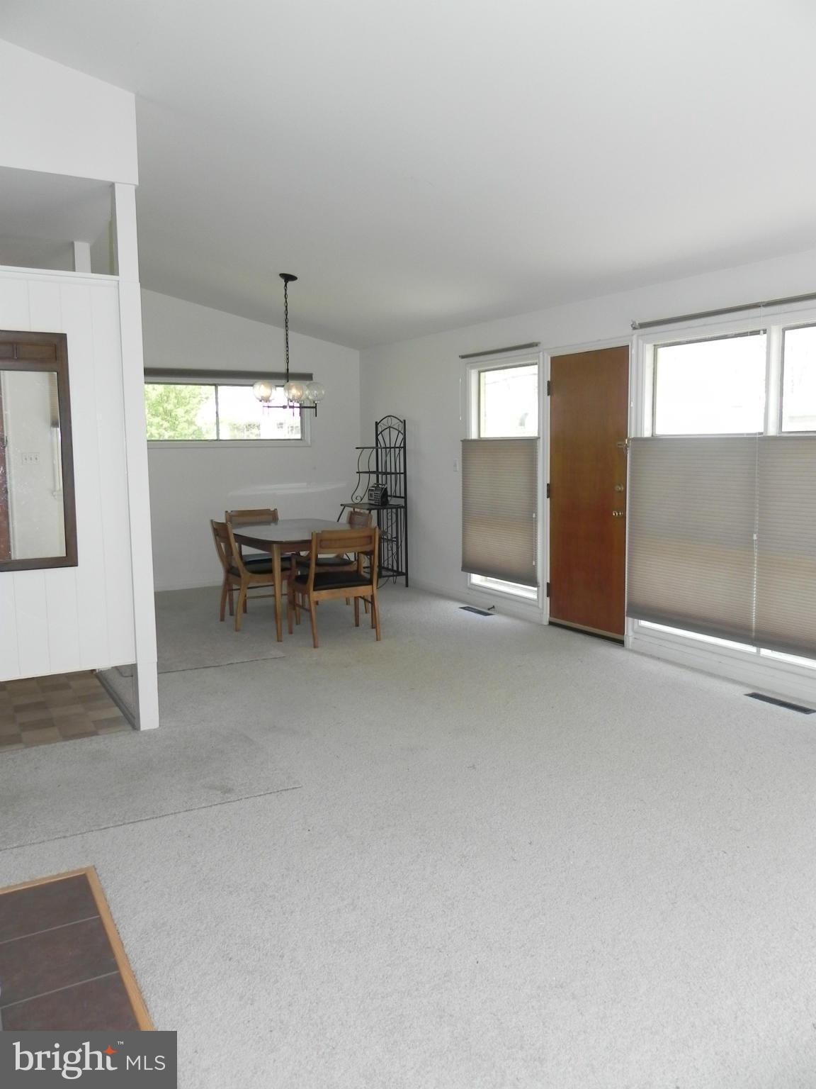 7420 Monita Road Baltimore, MD 21208 - Photo 8 of 24 a view of a livingroom with furniture and window