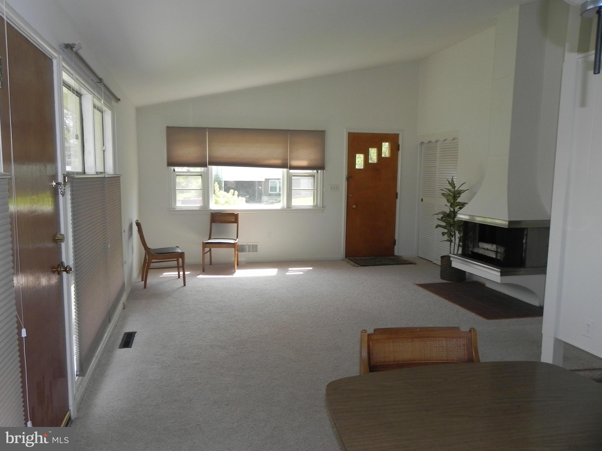 7420 Monita Road Baltimore, MD 21208 - Photo 9 of 24 a living room with furniture and a window