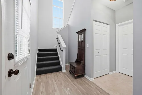 a view of a hallway with closet and entryway