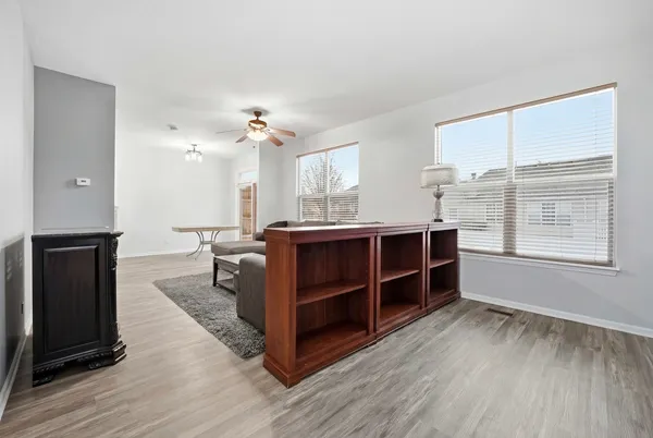 a view of a livingroom with furniture and a window