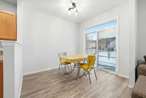 a view of a livingroom with furniture window and wooden floor