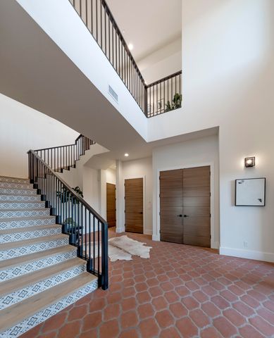 a view of hallway with a potted plant