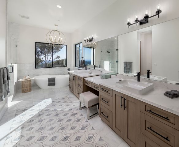 a spacious bathroom with a bathtub and a shower