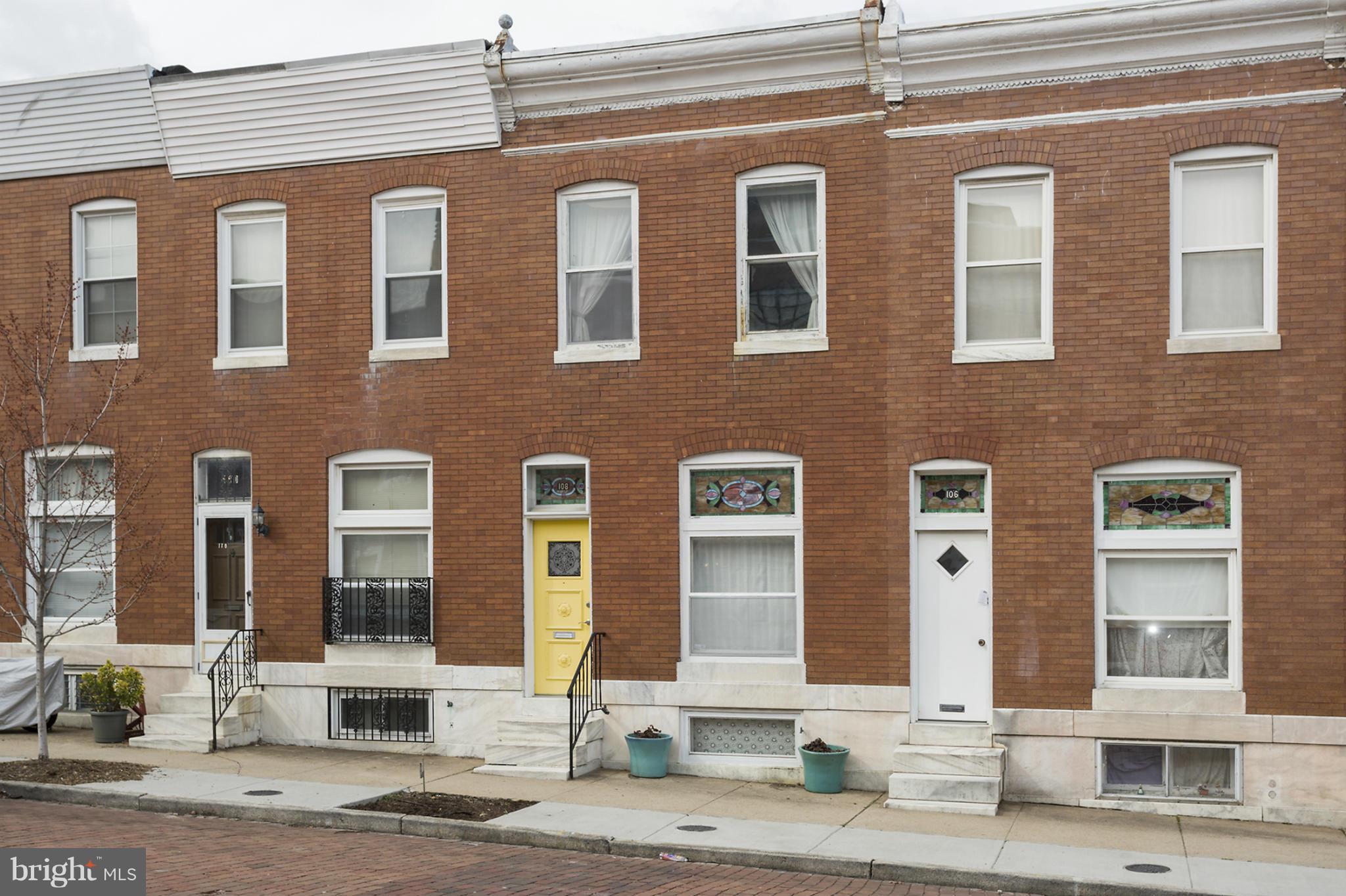 108 Rochester Place Baltimore, MD 21224 - Photo 1 of 24 a front view of a building with a street