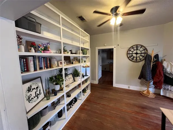 a view of an entryway with wooden floor