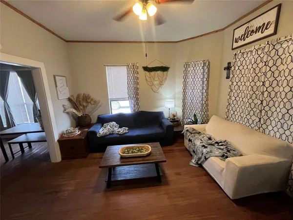 a living room with furniture and a rug
