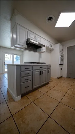 a kitchen with stainless steel appliances granite countertop a sink and cabinets