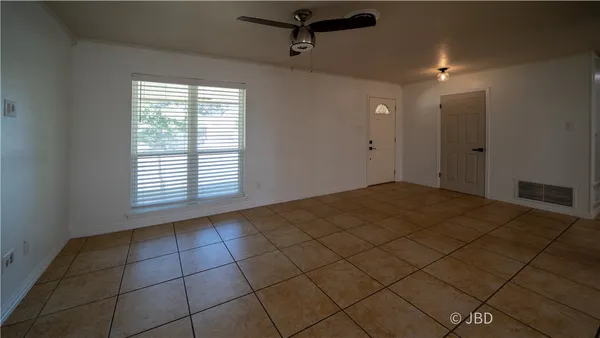 a view of a livingroom and a window