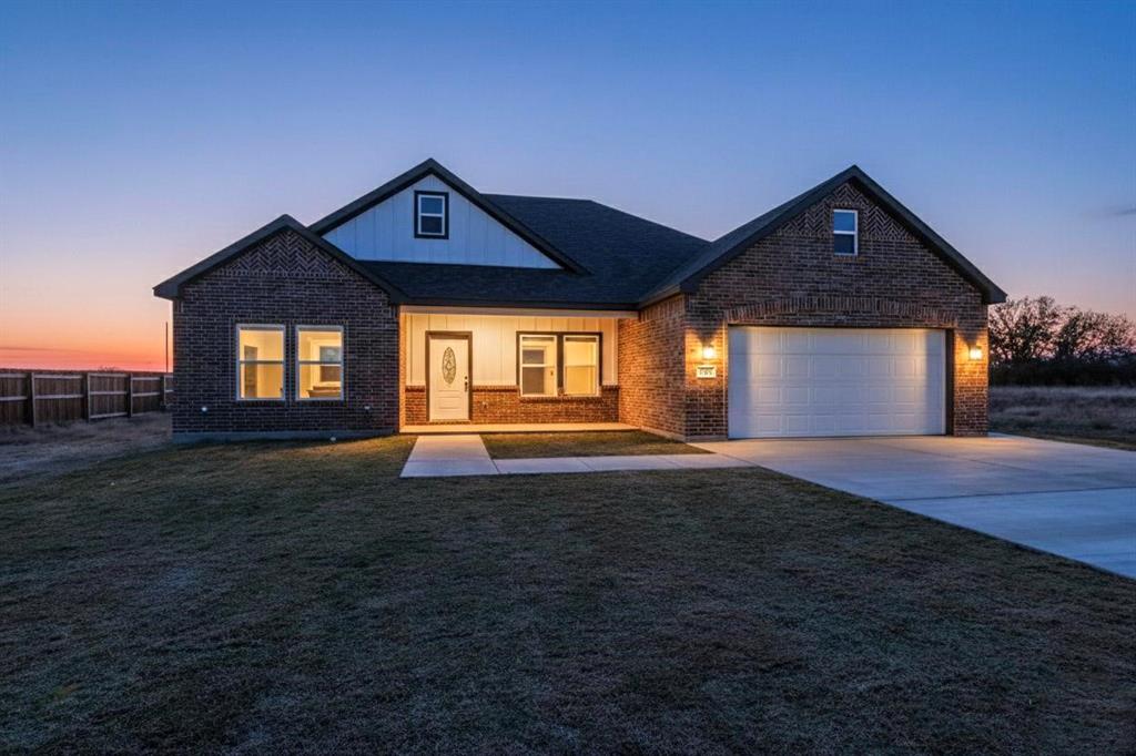 740 Section House Road Ennis, TX 75119 - Photo 2 of 31 a front view of a house with a yard