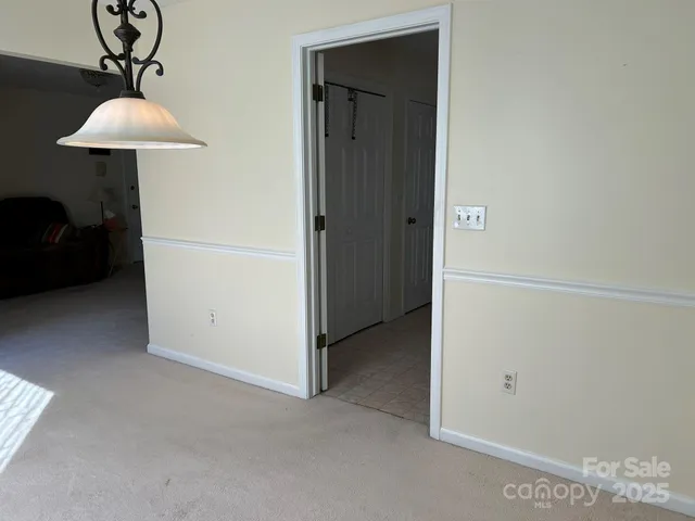 a view of a livingroom with a washer and dryer