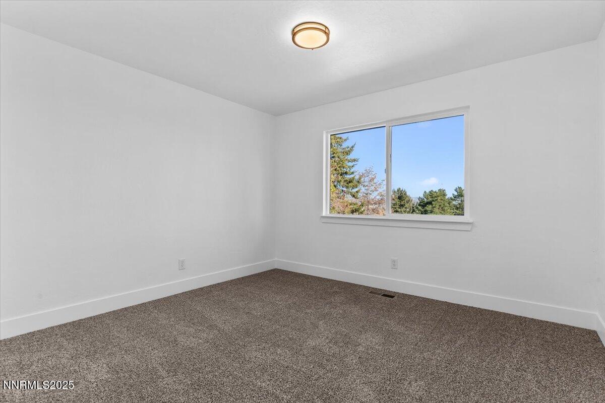 10655 Silver Spur Drive Reno, NV 89508 - Photo 18 of 34 an empty room with a window