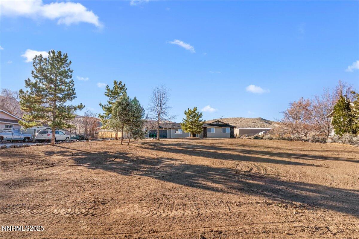 10655 Silver Spur Drive Reno, NV 89508 - Photo 23 of 34 a view of a building and trees in the background