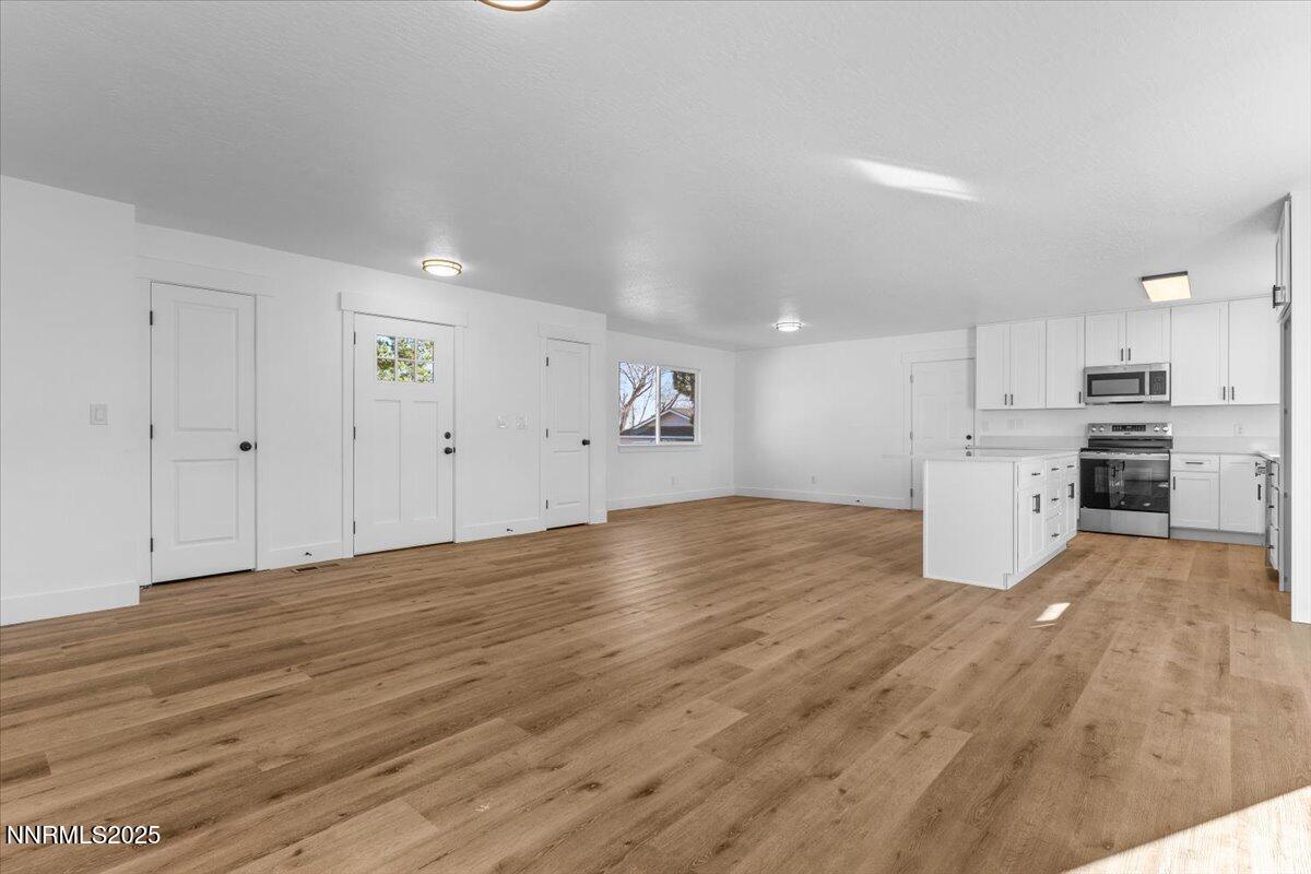 10655 Silver Spur Drive Reno, NV 89508 - Photo 10 of 34 a view of empty room with wooden floor