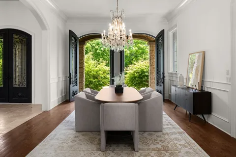 a living room with lots of furniture and wooden floor
