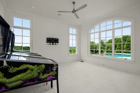 a bathroom with a toilet a sink a vanity and mirror