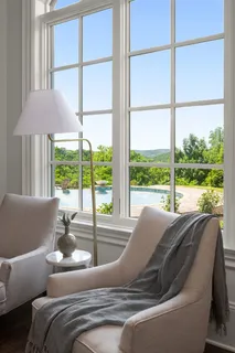 a bathroom with a granite countertop sink a mirror and a window