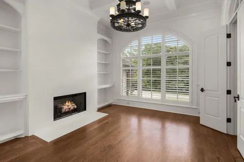 a living room with fireplace furniture and a flat screen tv