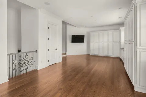 a front view of a house with swimming pool having outdoor seating