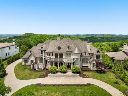 a view of staircase with white walls and windows