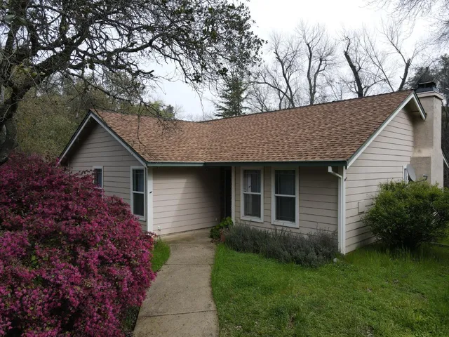 a kitchen with stainless steel appliances granite countertop a refrigerator a stove top oven a sink and dishwasher