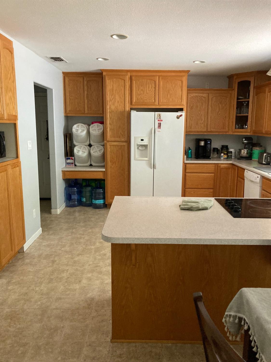 6705 Ravine Court Newcastle, CA 95658 - Photo 7 of 15 a kitchen with stainless steel appliances granite countertop a refrigerator a stove top oven a sink and dishwasher