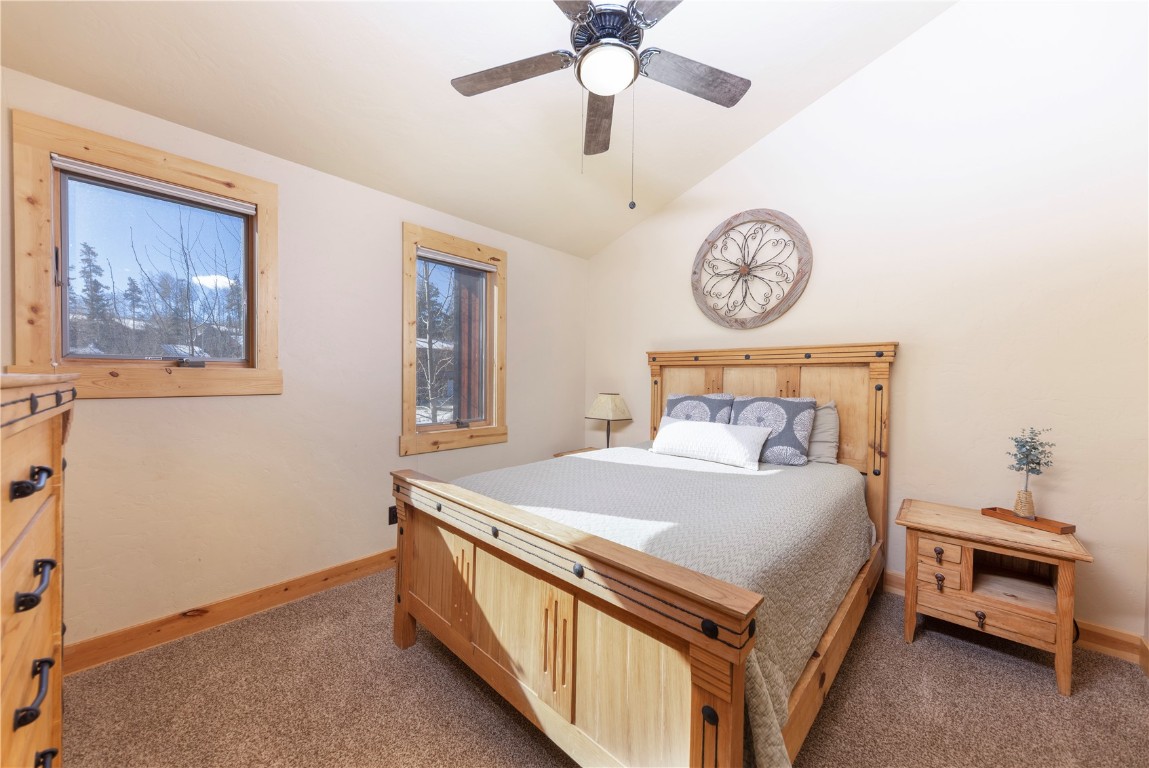 511 Ryan Gulch Road Wildernest, CO 80498 - Photo 16 of 37 Carpeted bedroom featuring lofted ceiling and a ceiling fan