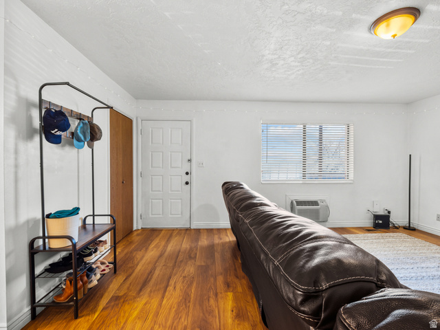 460 200 South Provo, UT 84606 - Photo 31 of 66 Living room featuring wood finished floors and a textured ceiling