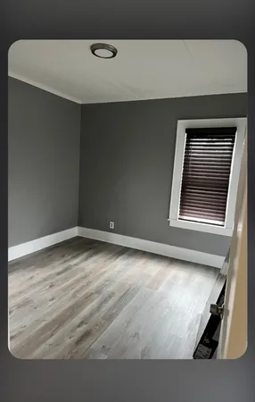 a white toilet sitting next to a shower curtain