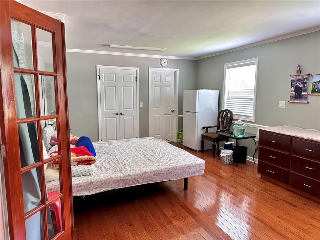 7326 Leland Lane Jonesboro, GA 30236 - Photo 7 of 18 a living room with furniture and a wooden floor