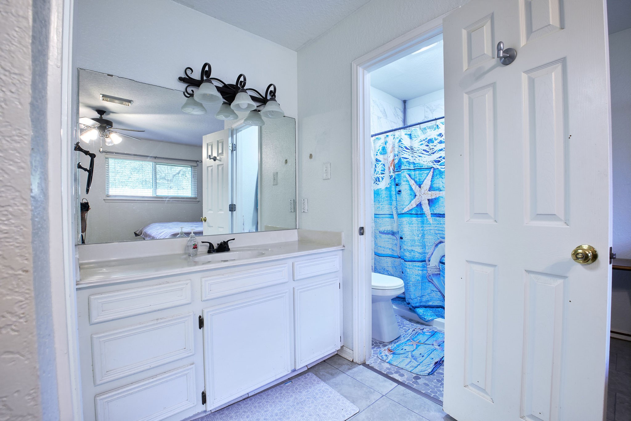 729 Newman Street Angleton, TX 77515 - Photo 13 of 24 a bathroom with a double vanity sink toilet and shower