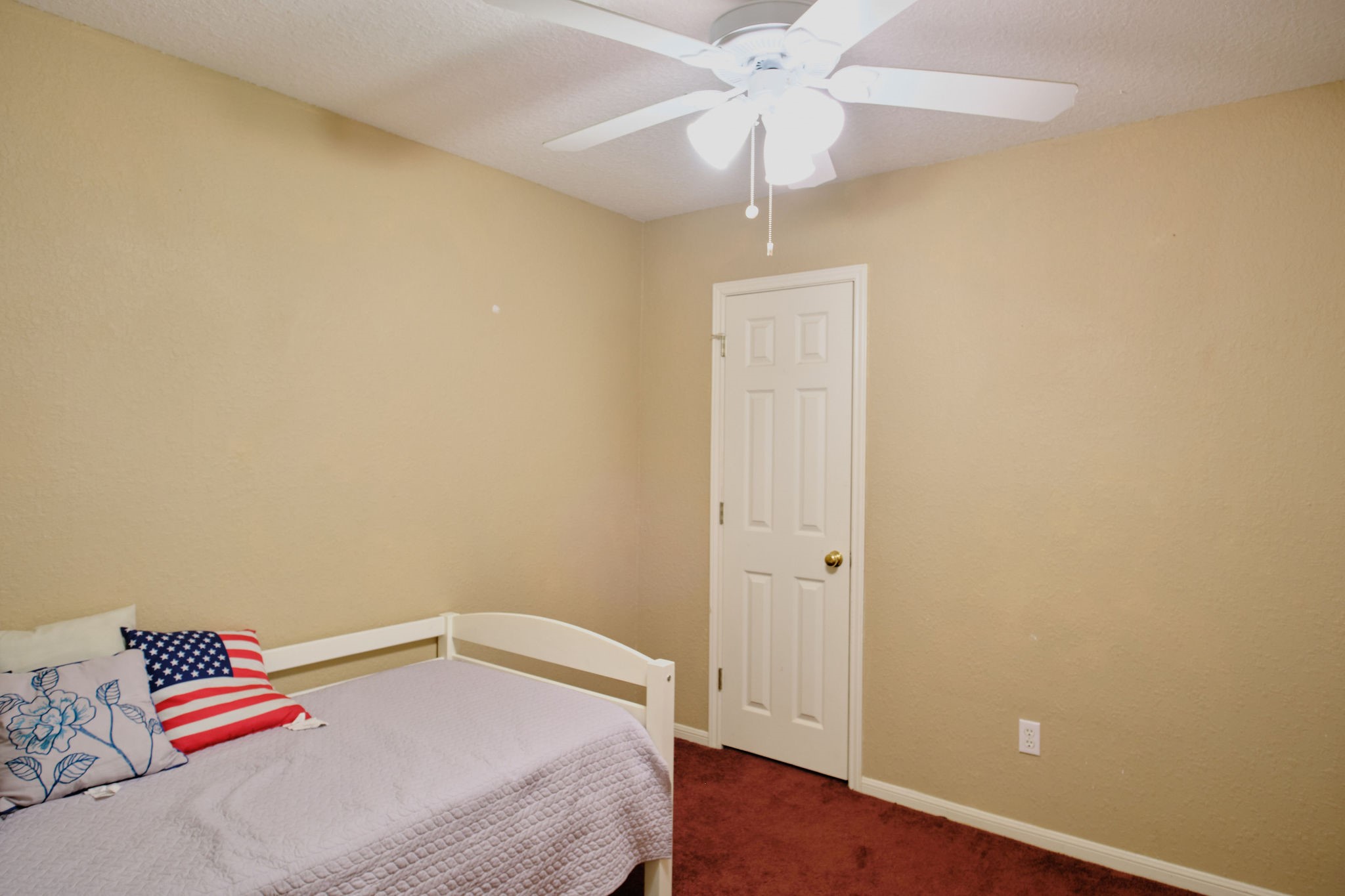 729 Newman Street Angleton, TX 77515 - Photo 15 of 24 a bedroom with a bed and a chandelier