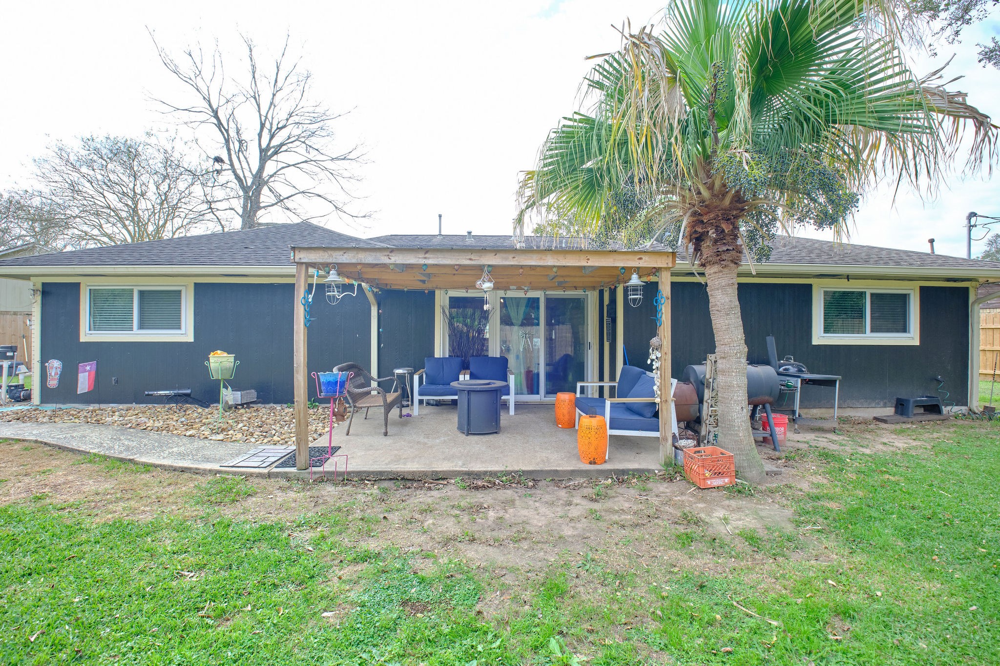 729 Newman Street Angleton, TX 77515 - Photo 18 of 24 a front view of house with yard and barbeque oven